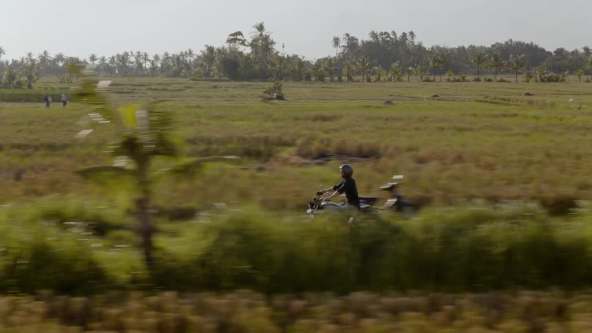 A motorcyclist rides in the country