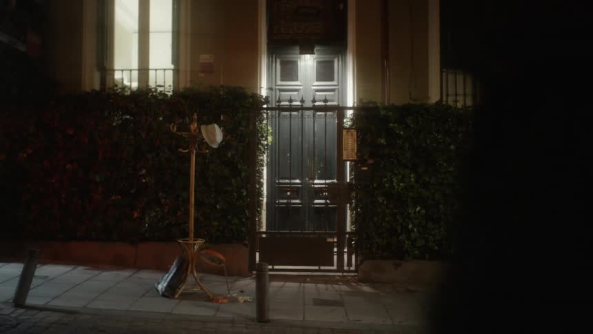A coat rack sits outside of a building