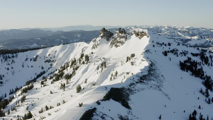Snow covers a mountain ridge