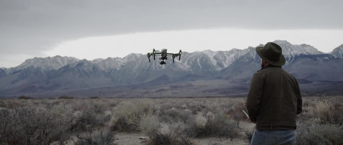 A drone lifts off the ground and hovers