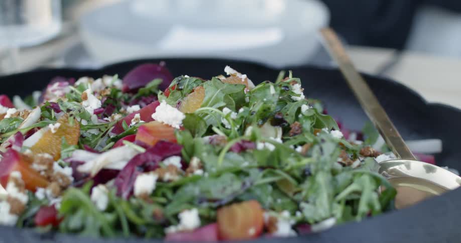 Salad sits in a bowl