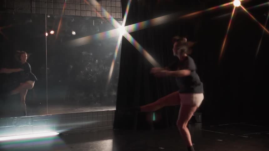 Dancer does pirouettes in a studio