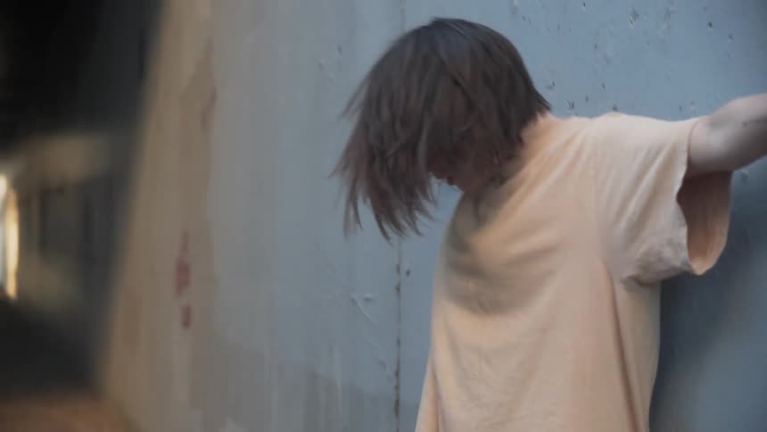 A woman shakes and falls to the ground