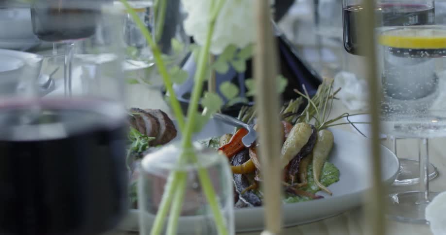 Woman sets the table for a dinner party