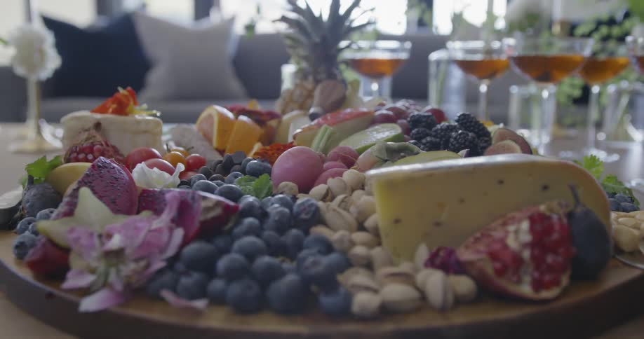 A cheese plate sits on a coffee table