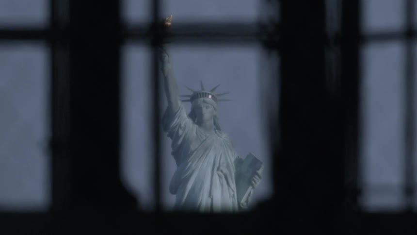 Looking through the window at the statue of liberty