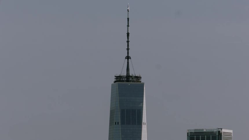 The tower is reaching into the clear sky
