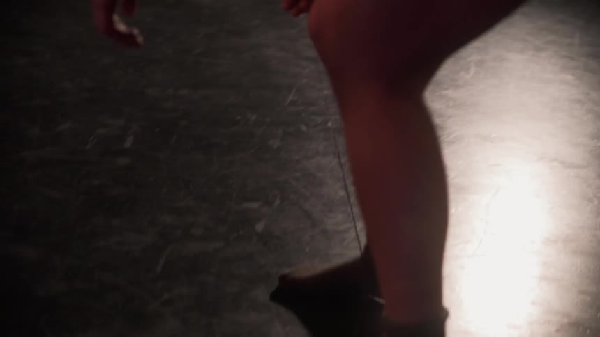 A woman dances on stage