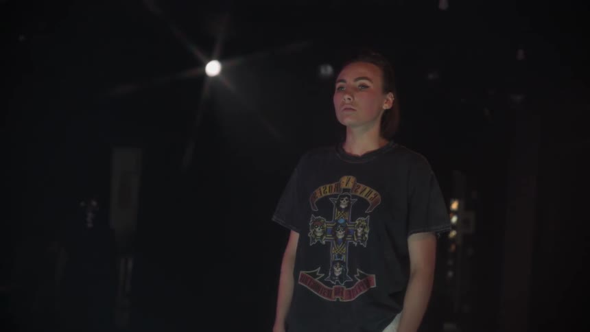 Woman breathes heavily in a dark room