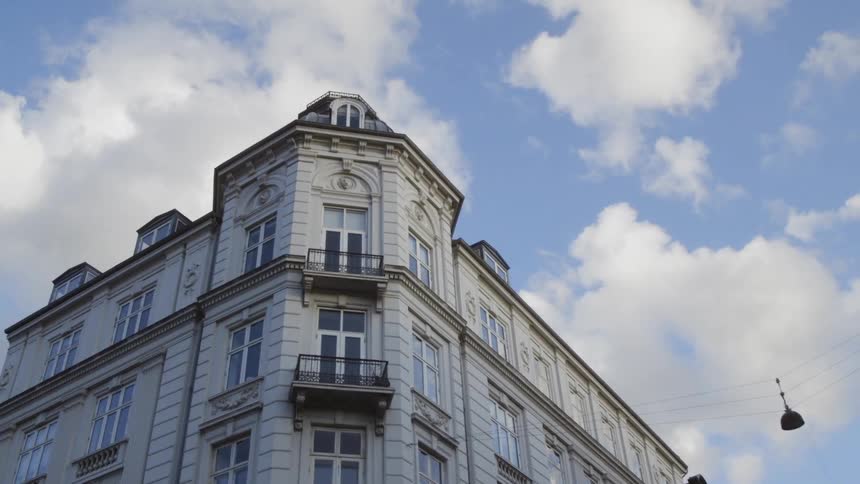 Clouds float above a city building
