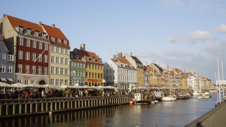 Boats float on a city canal