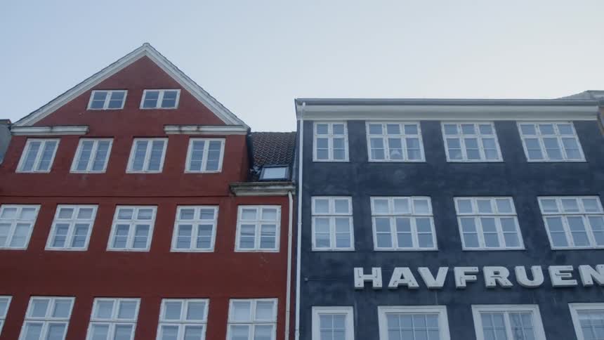 Red and blue buildings next to each other