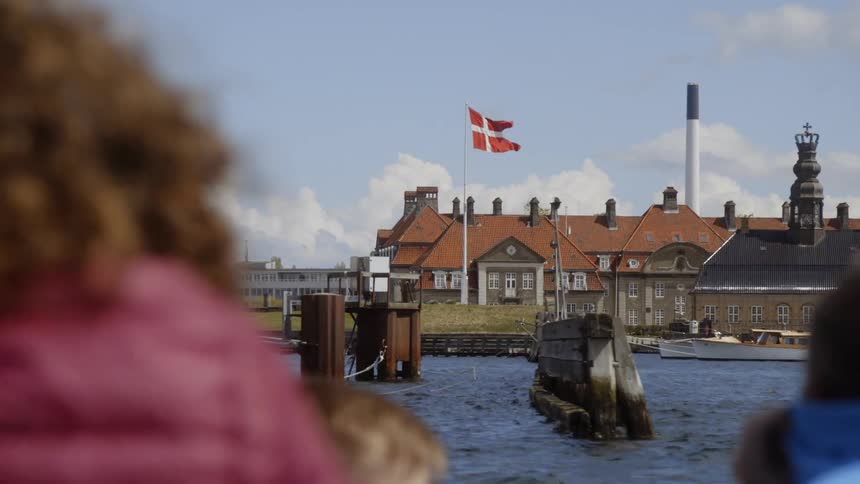 People boat by a building