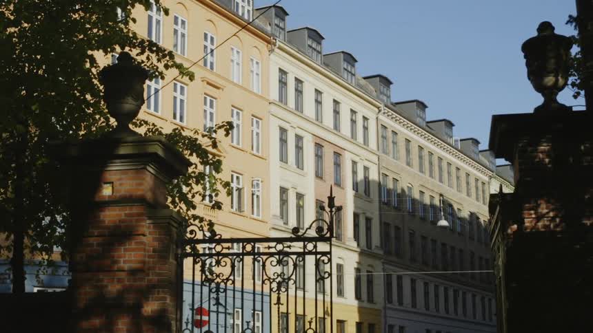 Metal gates lead to a building