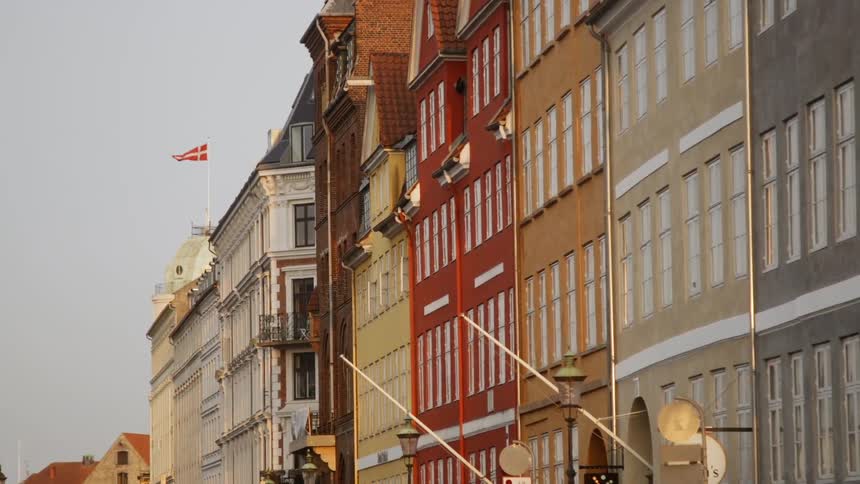 The flag is blowing in the wind on the building