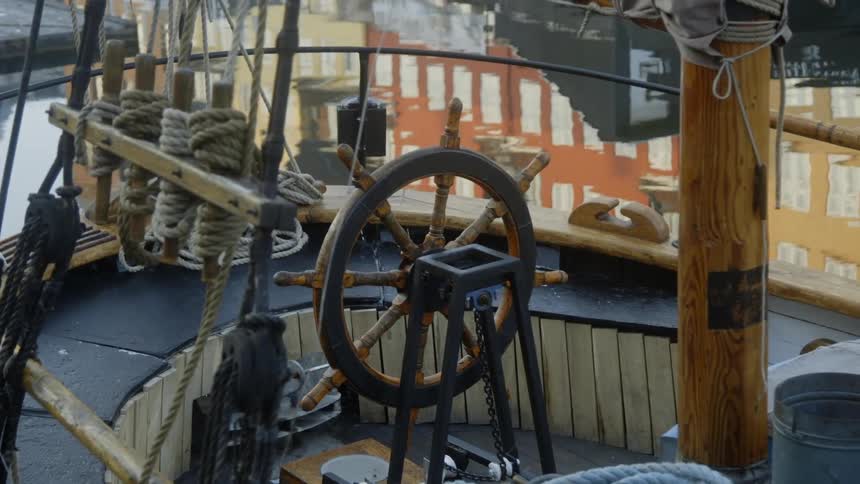 A ship floats on a canal