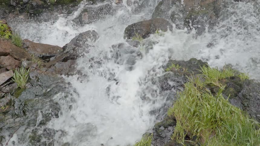 Water splashes over the rocks in a creek