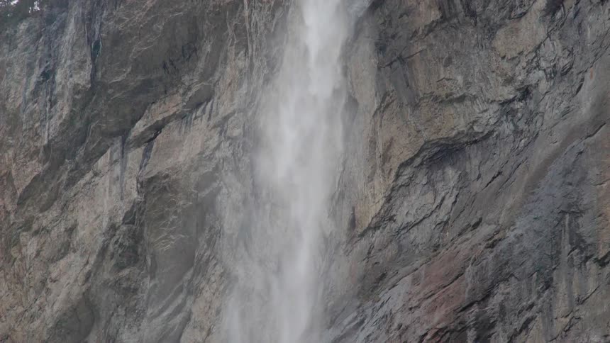 Water is pouring off the side of the mountain