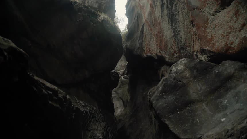 Sun shines down in a rocky cave