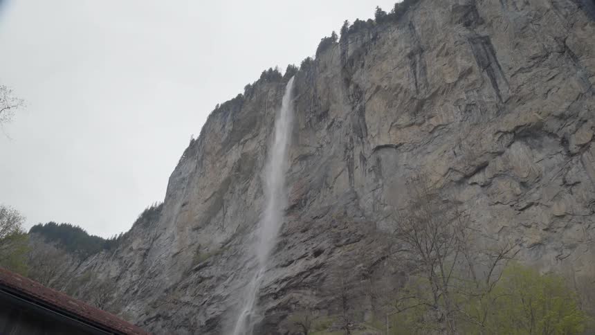 Water cascades down the side of a mountain