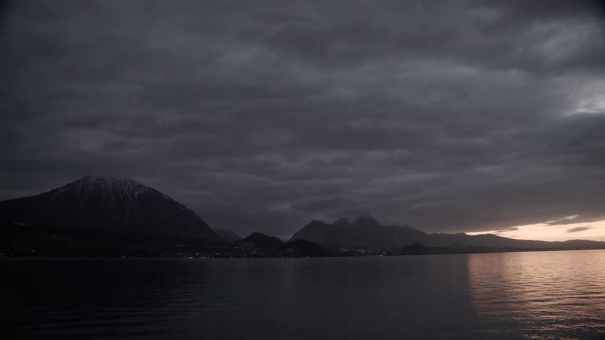 The sun is nearly set on a very cloudy day