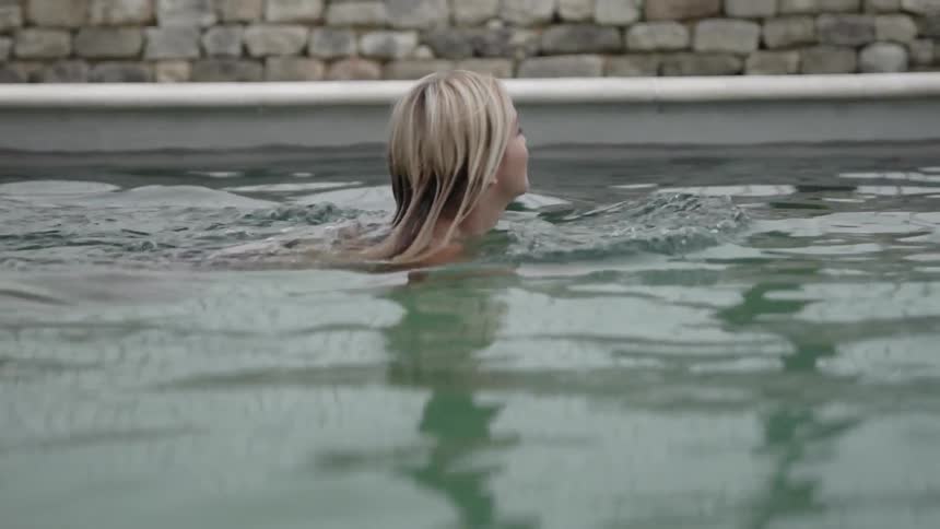 A woman swims in the pool