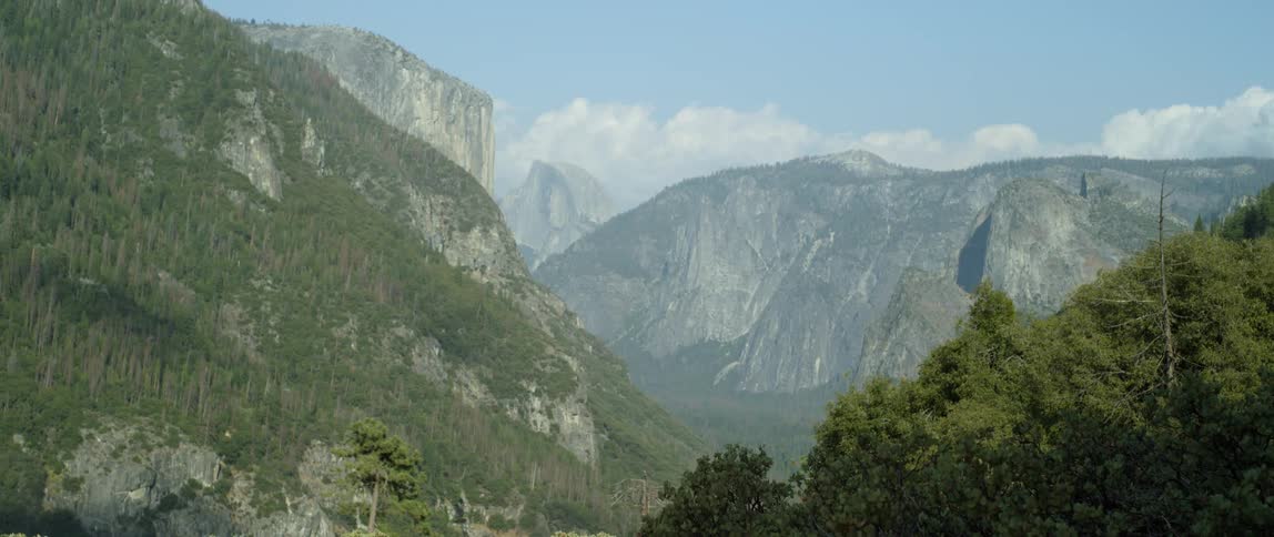 Clouds float over mountains