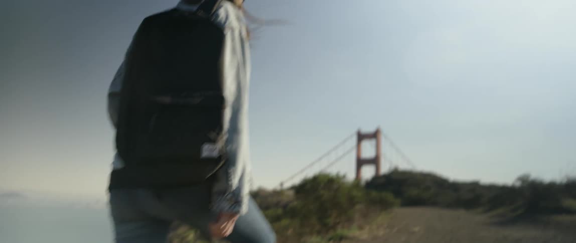 A woman hikes near the golden gate bridge