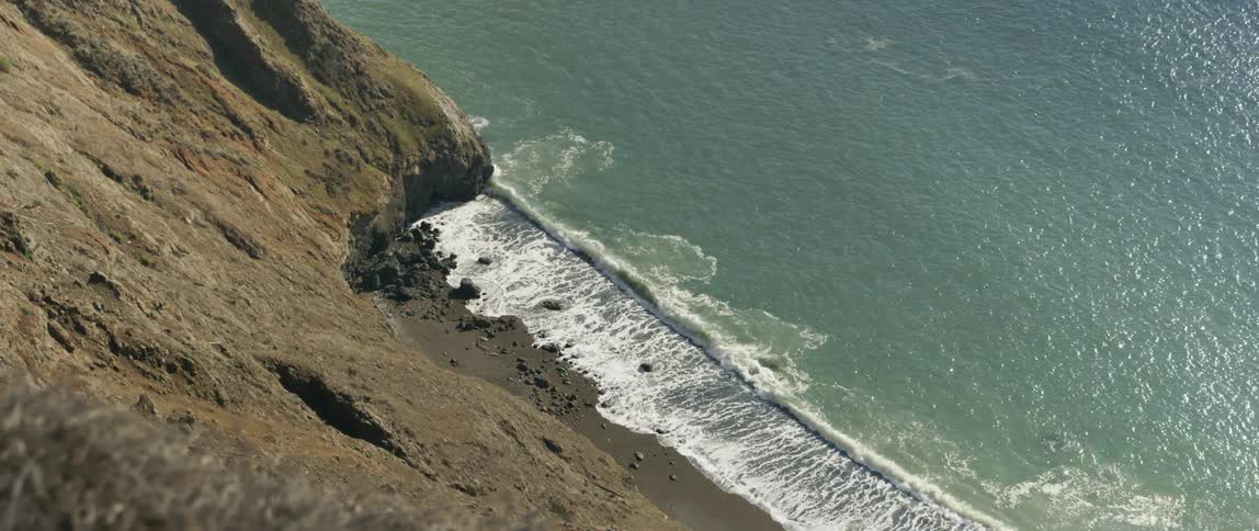 Ocean waves crash into a beach
