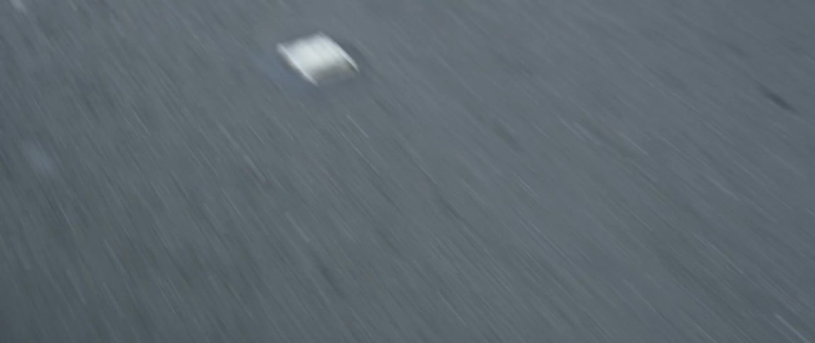 An asphalt road is passing by in daylight