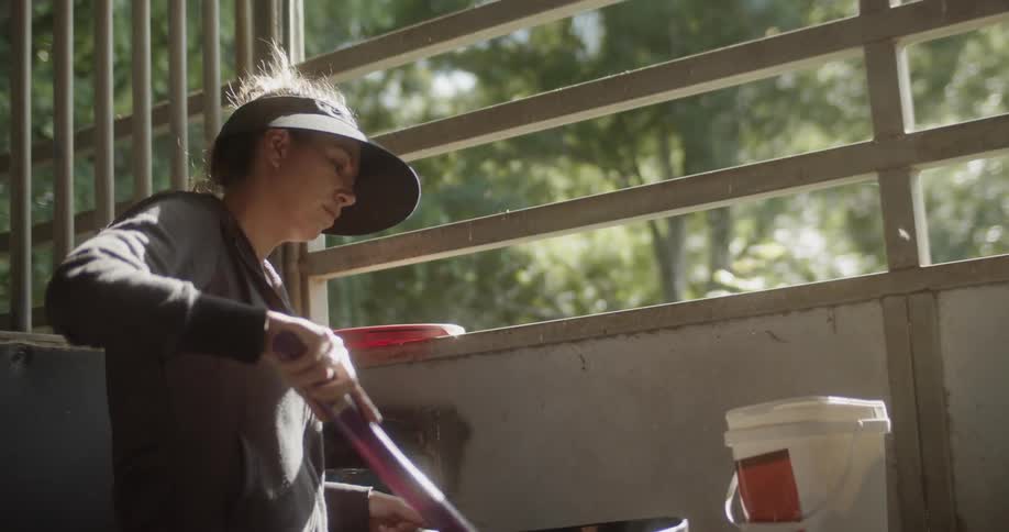 Woman stirs a mixture in a bowl