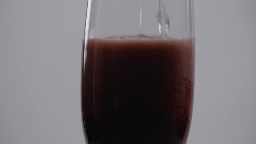 Liquid is poured into the glass
