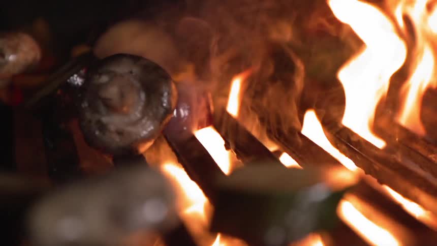 The fire is cooking food that is dropping
