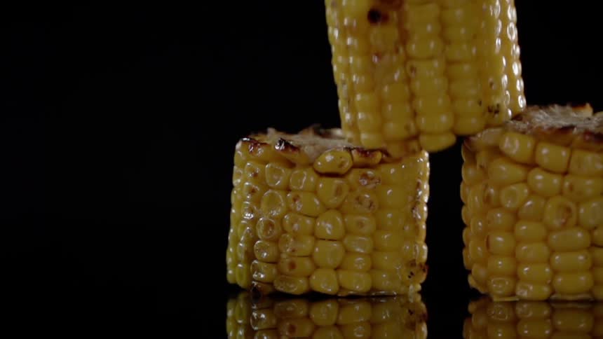 Pieces of grilled corn land on one another