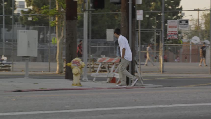 Man crosses a city street