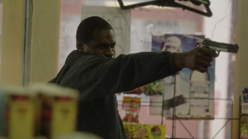 A man walks into a store and begins firing a gun