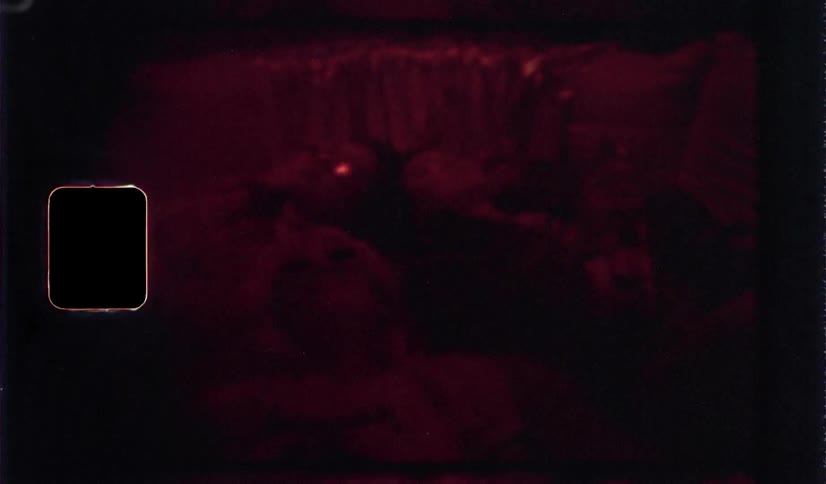 Lights shine in the dark as people sleep
