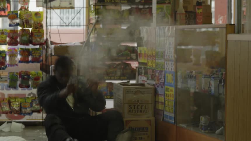 Man shoots a gun and is shot in a convenience store