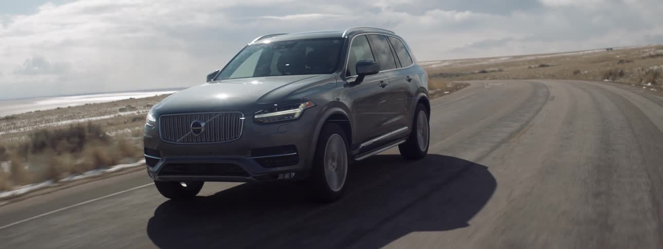 An suv is driven on a rural road