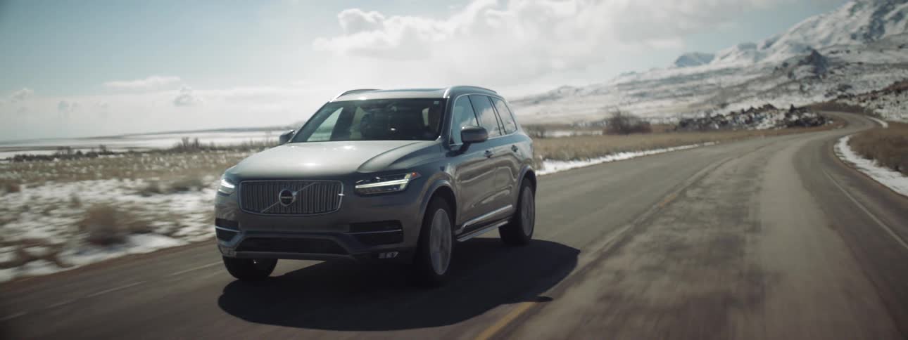 A volvo is driven on a rural road