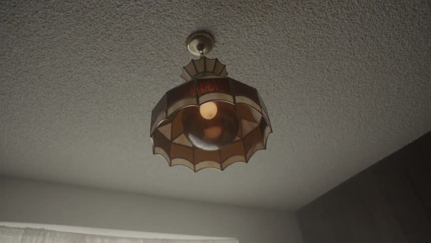 The light is flickering fast in the dark room