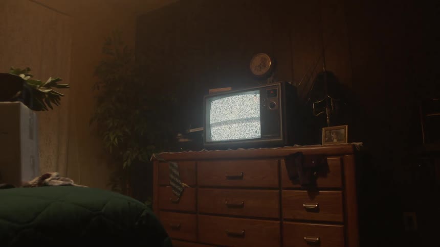 Static flashes on a television sitting on a bedroom dresser