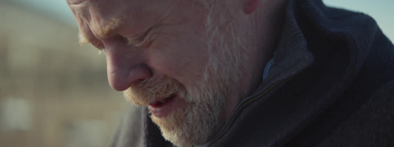 Man cries while looking at an ultrasound of a baby