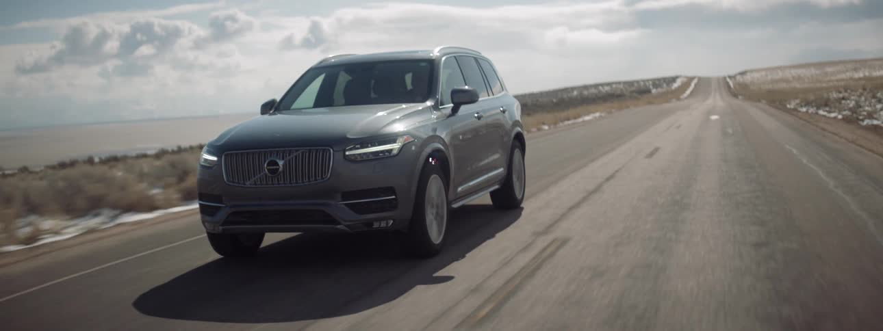 An suv is driven on a rural road