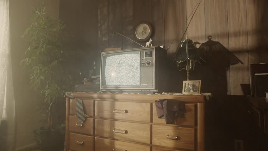The television in the bedroom is flickering