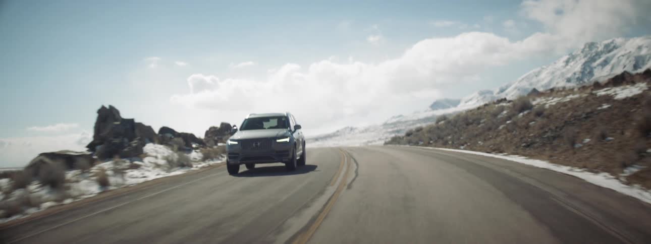 An suv is driven on a rural road