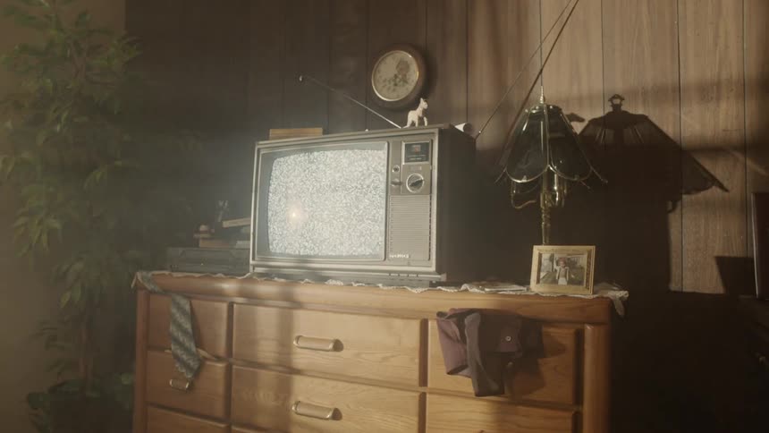An old television displays static