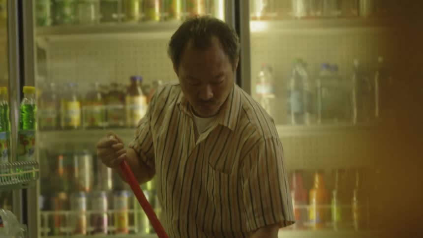 A man is mopping the floor in his store