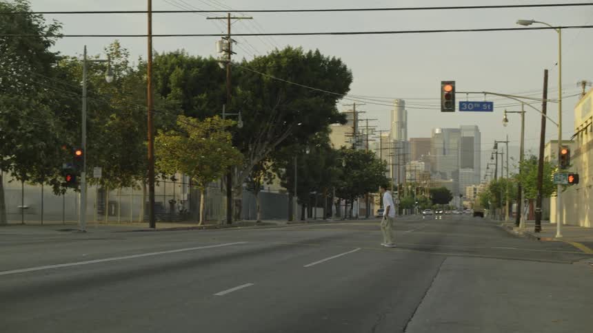 Man crosses a city street