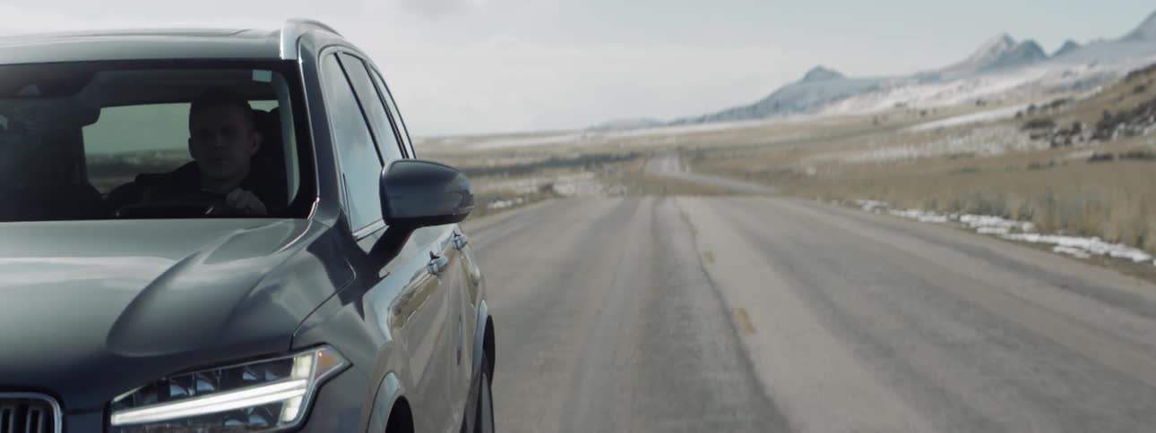 Man drives on a rural road